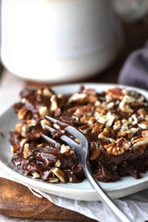 Fork cutting a piece of Texas sheet cake