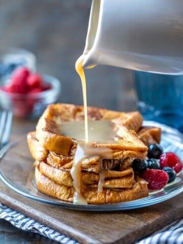 Buttermilk Syrup pouring onto a stack of French toast