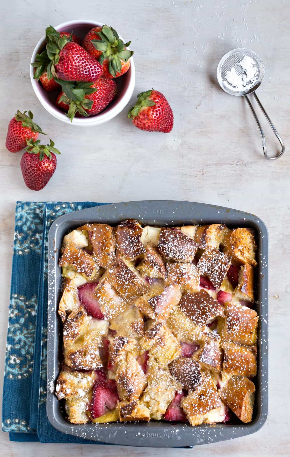 Overnight Strawberry Cream Cheese-Stuffed French Toast Casserole in a metal baking pan. 
