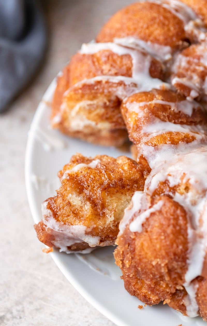 Piece of monkey bread with icing on it
