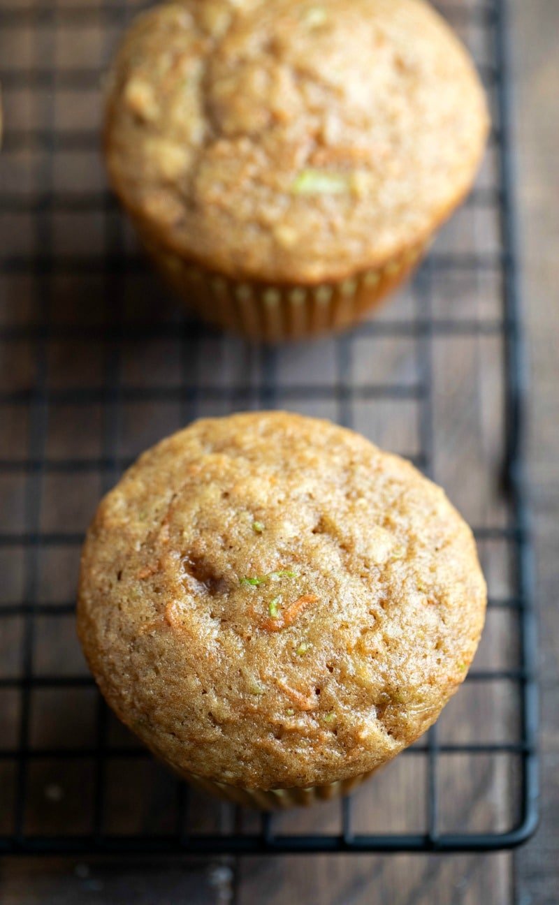 Carrot Zucchini Muffin Recipe Carrot Zucchini muffins on a black wire cooling rack
