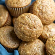 Basket with carrot zucchini muffins in it
