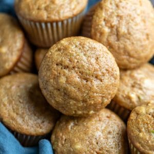 Basket with carrot zucchini muffins in it