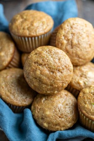 Basket with carrot zucchini muffins in it