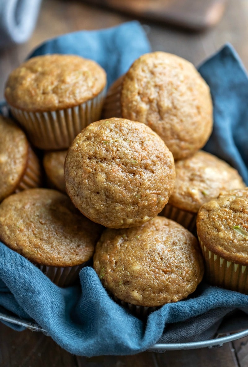 Blue linen napkin under carrot zucchini muffins