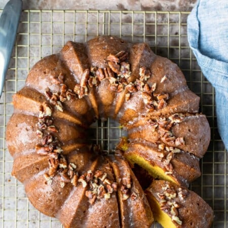 Irish cream bundt cake on a gold wire cooling rack