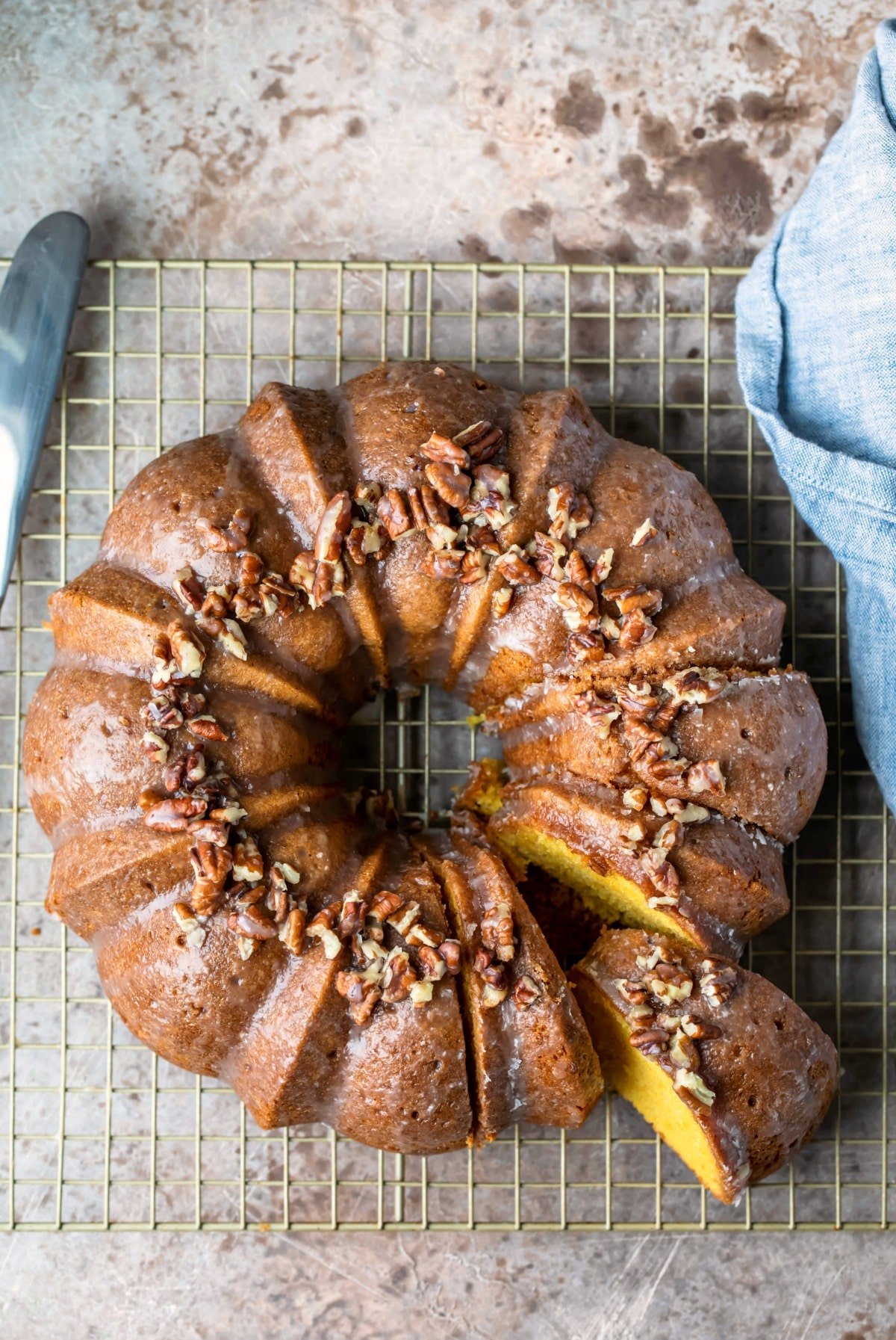 Irish cream bundt cake on a gold wire cooling rack