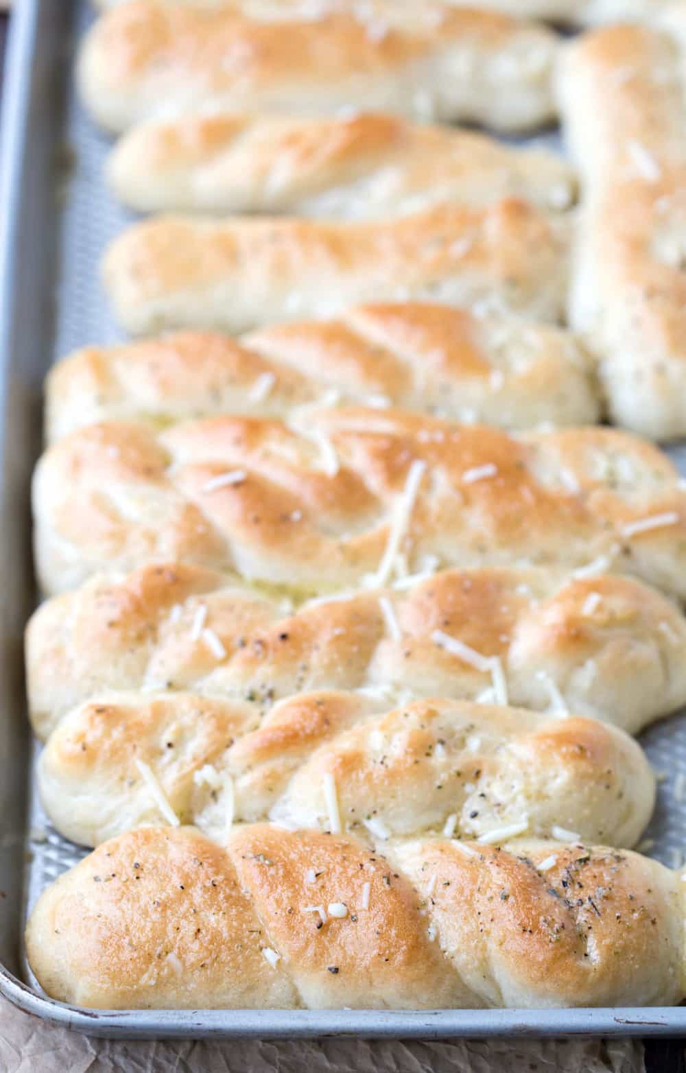 Silver baking pan with easy homemade breadsticks in it