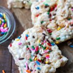 Cake batter rice krispies on a wooden board