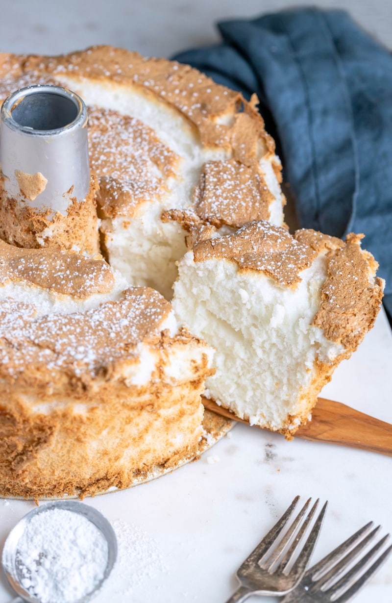 Slice of angel food cake on a wooden knife