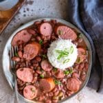 Plate of crock pot red beans and rice with a scoop of white rice