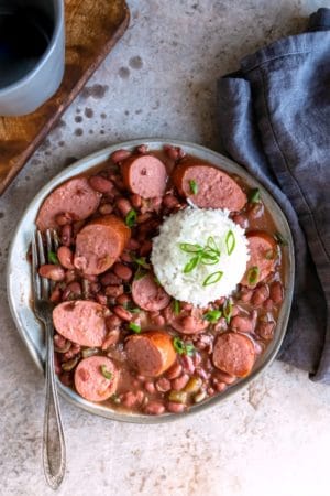 Plate of crock pot red beans and rice with a scoop of white rice