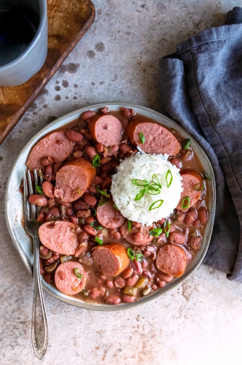 Plate of crock pot red beans and rice with a scoop of white rice