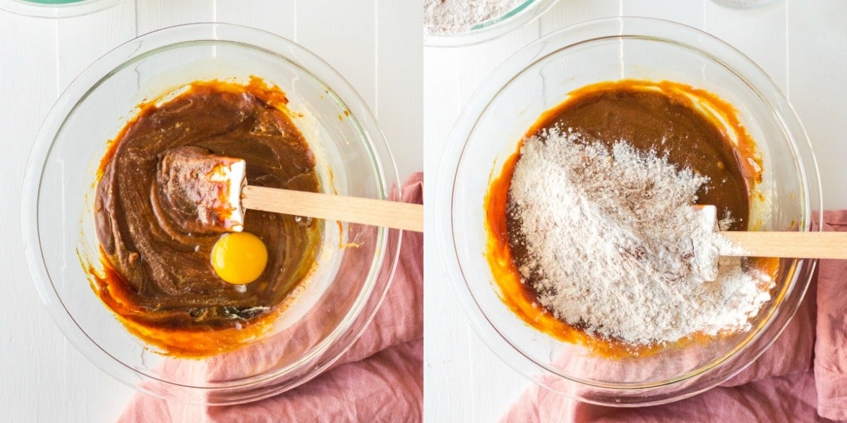 an egg mixing into a bowl of molasses butter and sugar