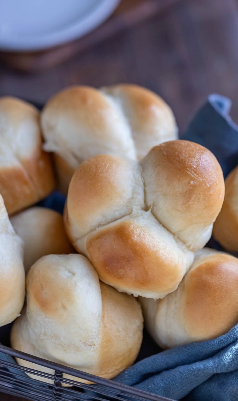 Big soft dinner rolls in a linen lined basket