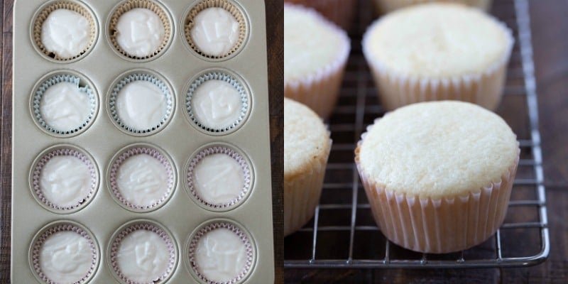 White cupcakes on a wire cooling rack