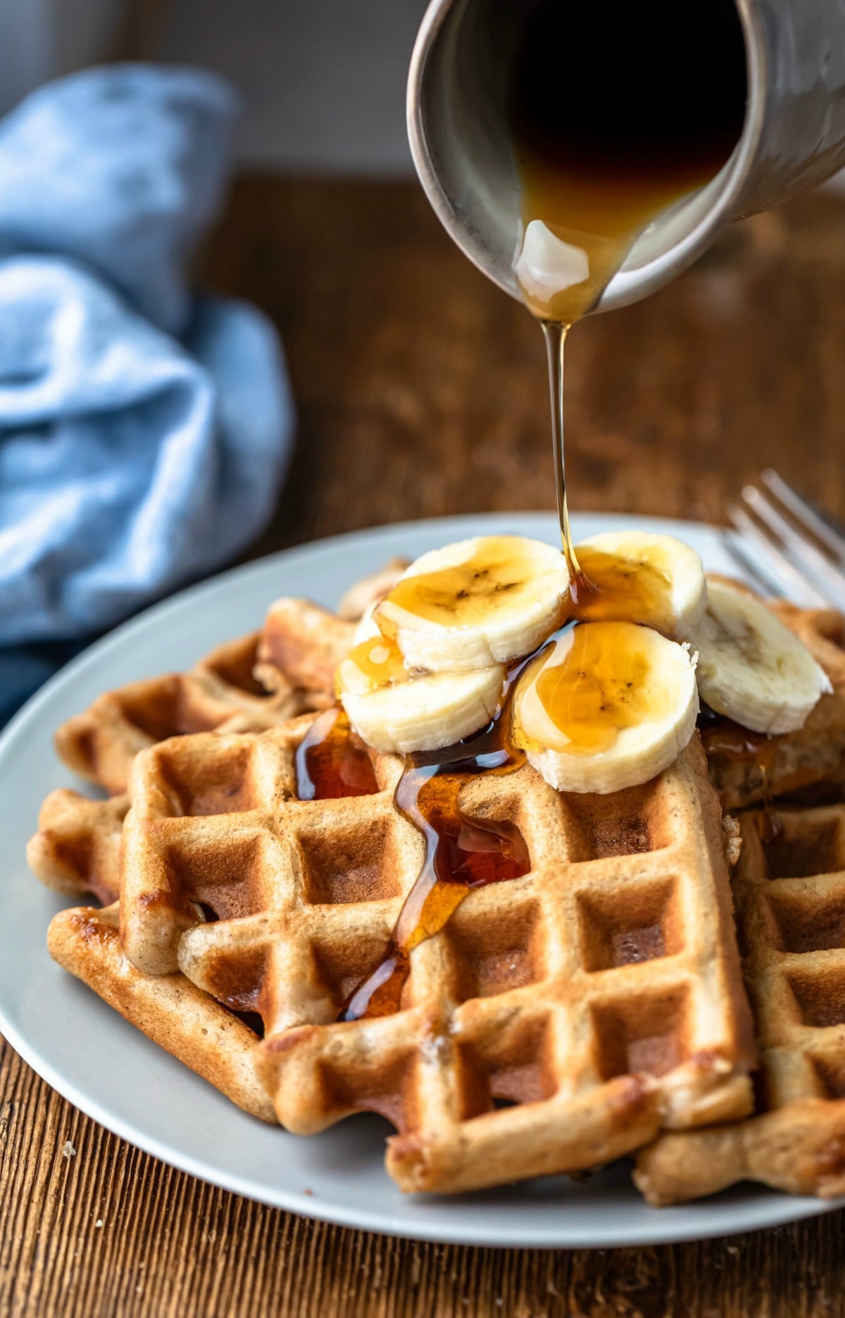 Banana waffles with maple syrup on top