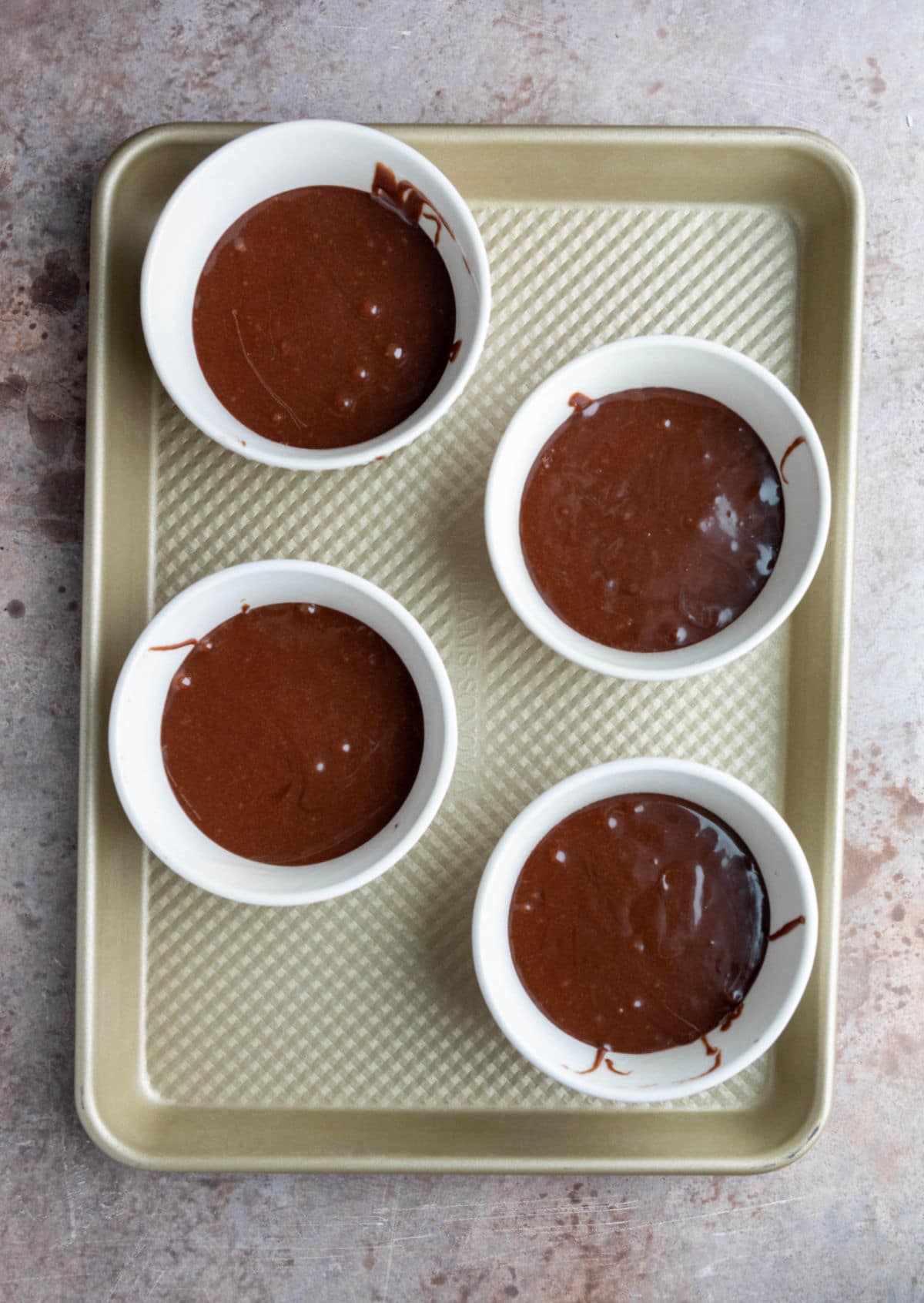 Ramekins on a baking sheet