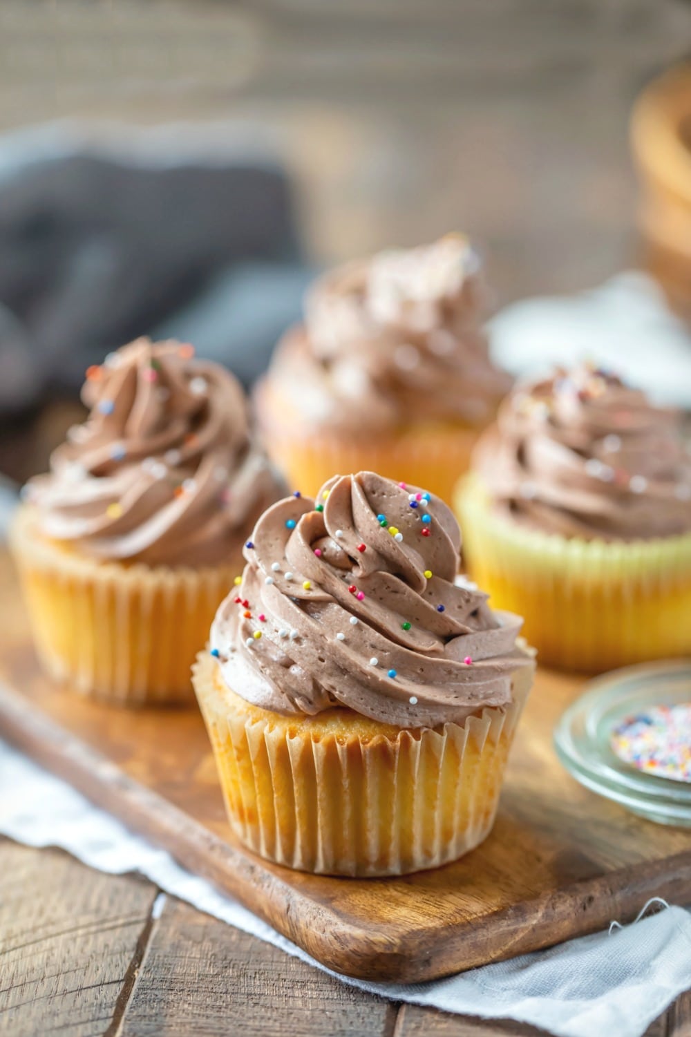 Chocolate Whipped Buttercream Frosting on a yellow cake cupcake