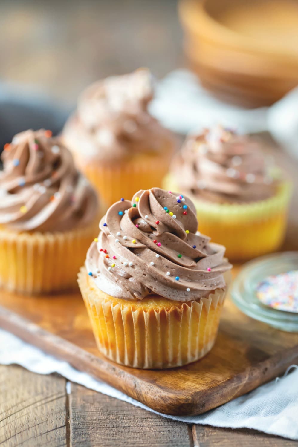 Chocolate Whipped Buttercream Frosting on a yellow cupcake