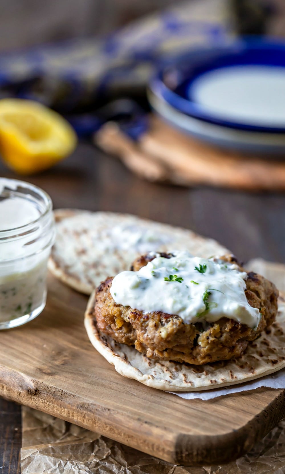 Greek chicken burger topped with tzatziki sauce