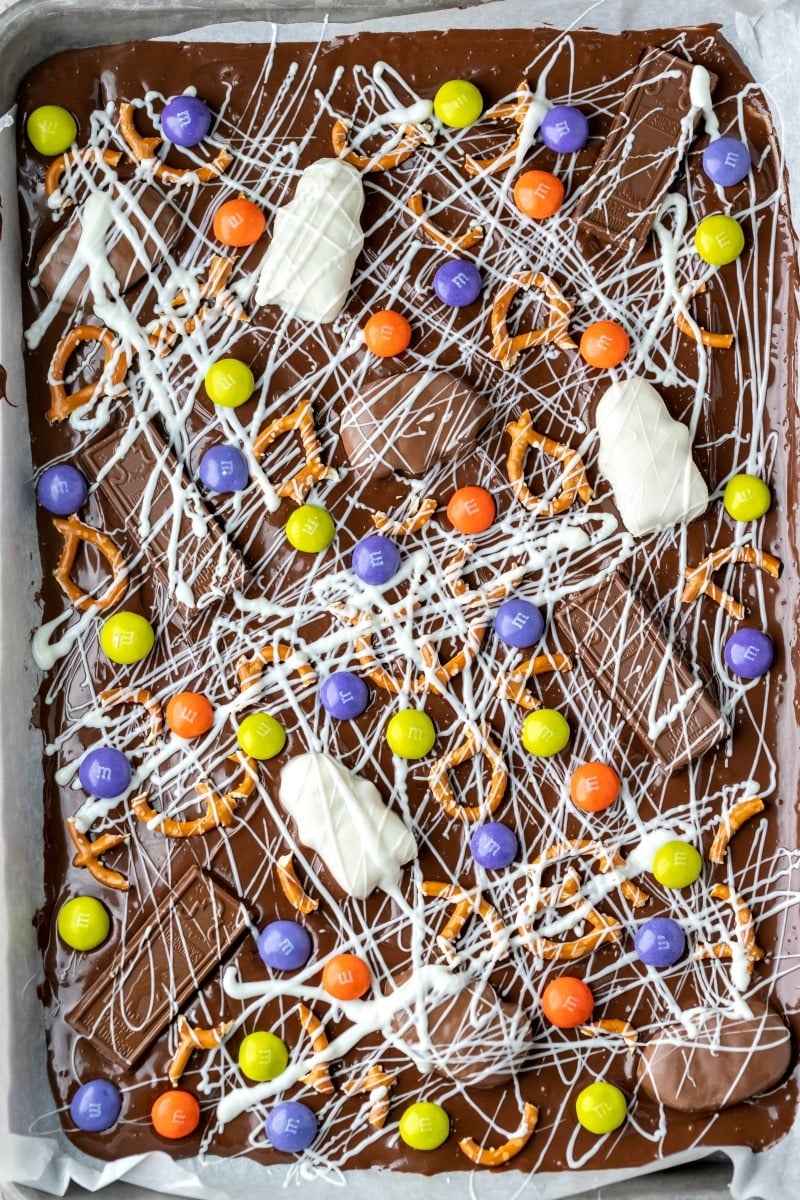 Tray of Halloween candy bark in a metal pan