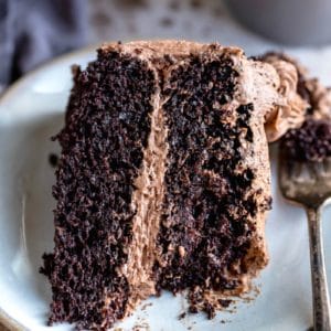 Slice of hot chocolate cake with a piece of it on a fork