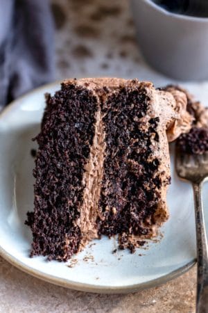 Slice of hot chocolate cake with a piece of it on a fork