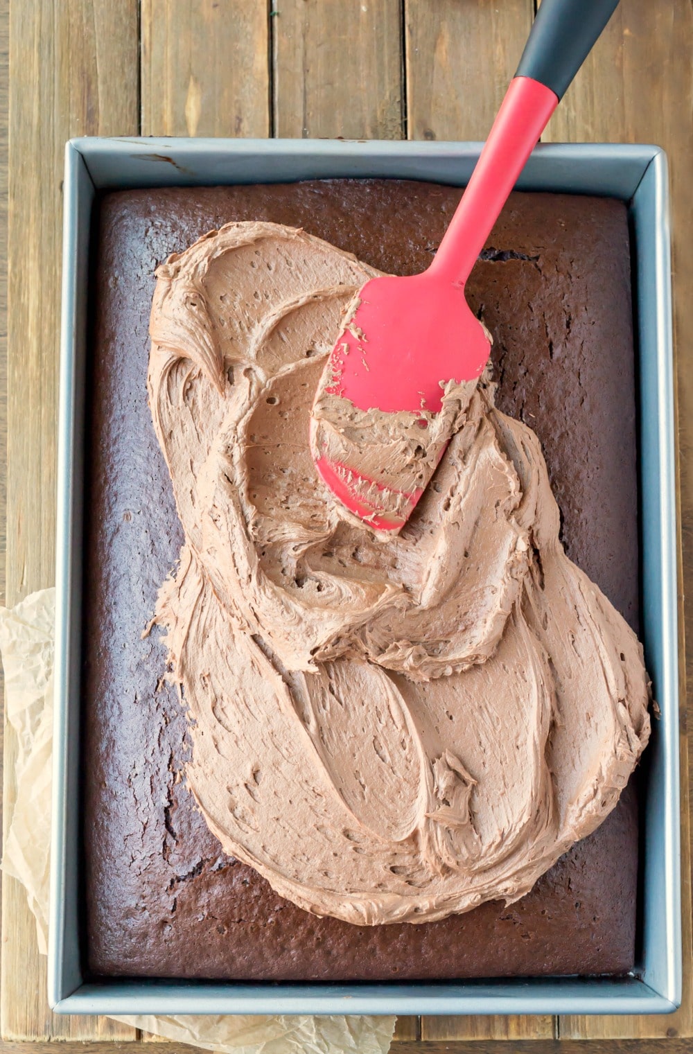 Chocolate Buttercream Frosting Chocolate Buttercream Frosting spread on a chocolate sheet cake