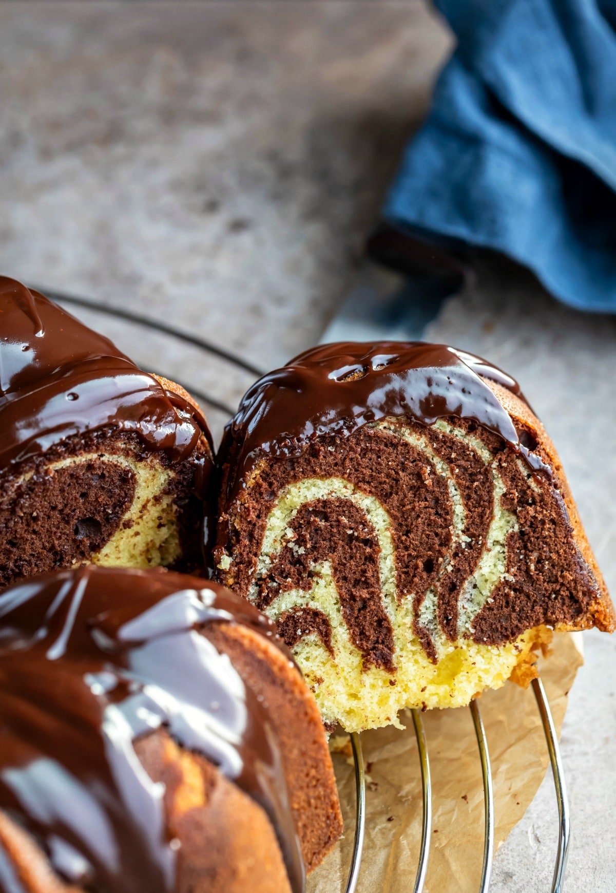 Marble bundt cake topped with chocolate ganache