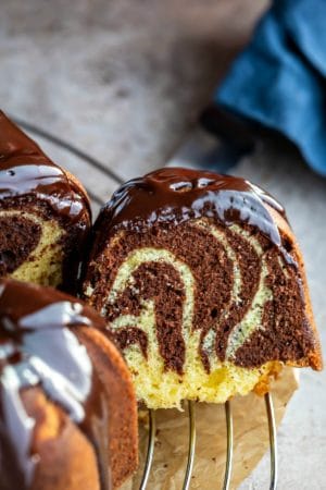 Slice of marble bundt cake cut from the cake