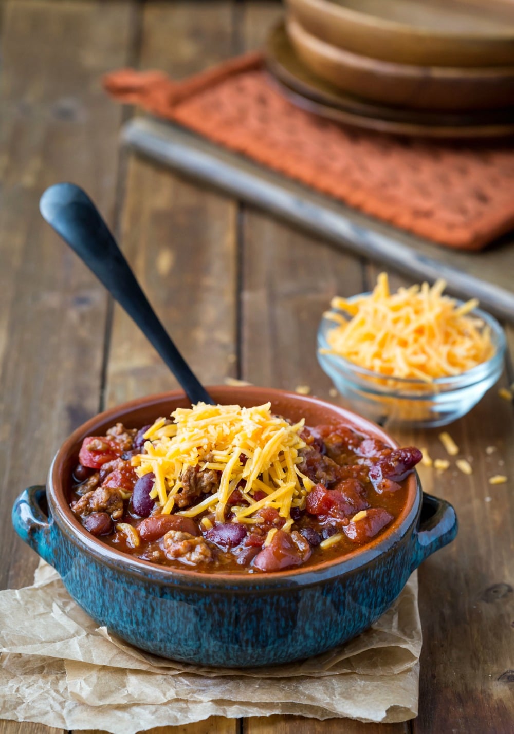 Barbecue Chili topped with shredded cheddar cheese