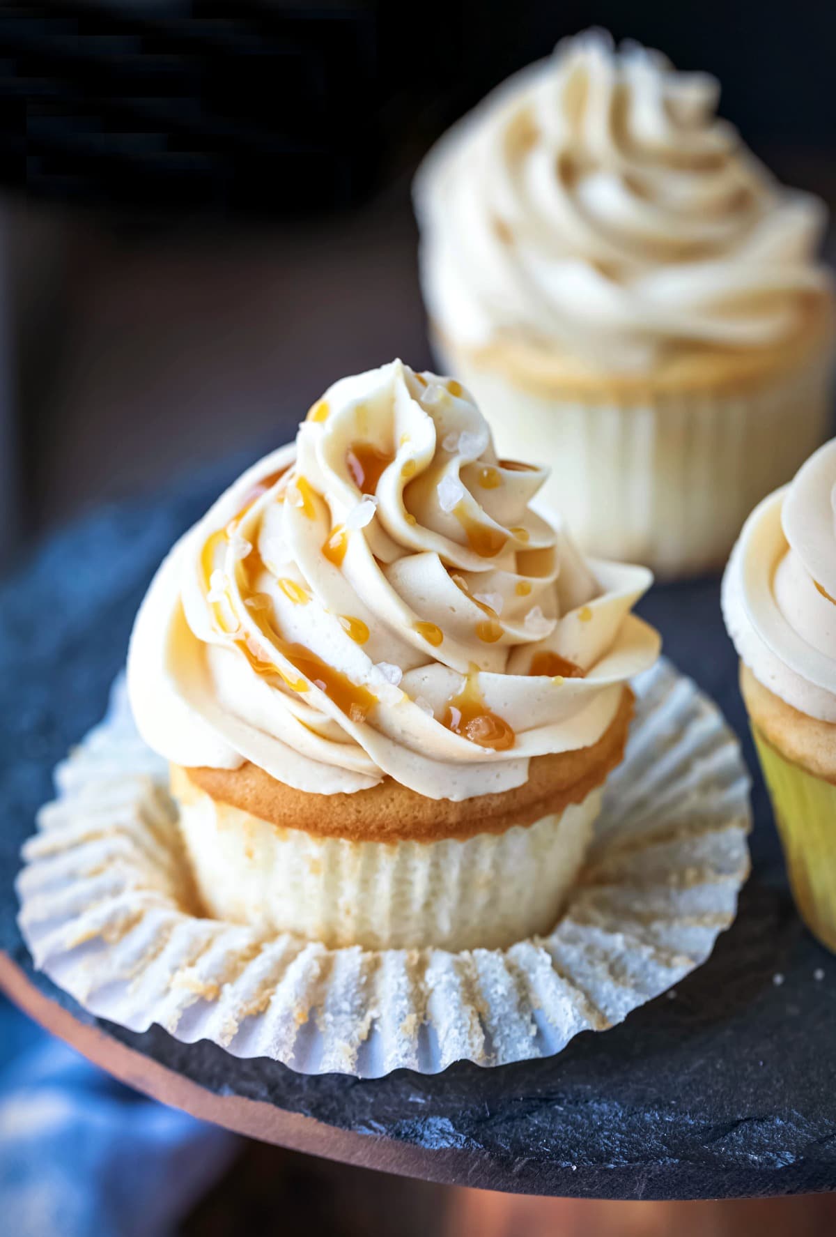 Vanilla cupcake topped with caramel frosting.