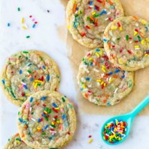 Funfetti cookies and sprinkles on a marble background
