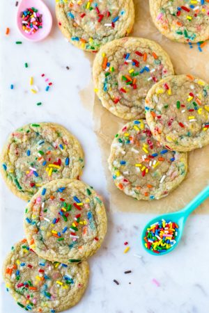 Funfetti cookies and sprinkles on a marble background