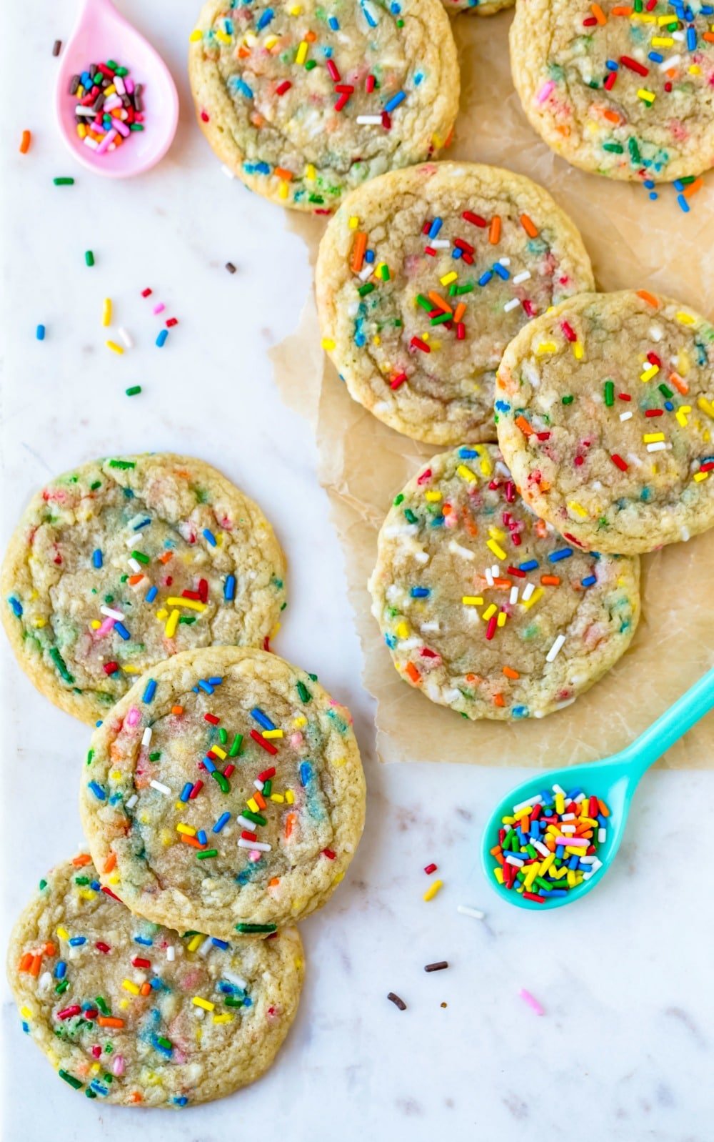 Funfetti cookies and sprinkles on a marble background