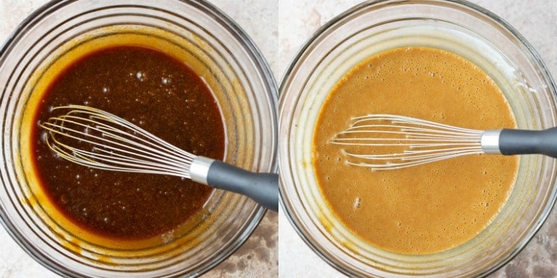 Gingerbread muffin batter in a glass mixing bowl with a whisk