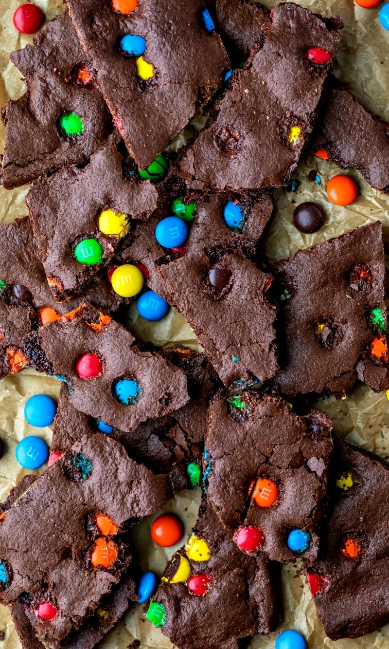 M&M brownie bark on a piece of parchment paper