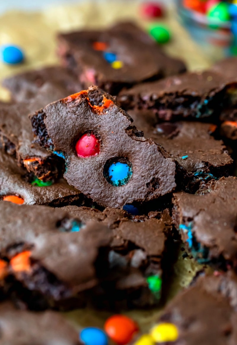 Piece of M&M brownie bark with red and blue M&Ms