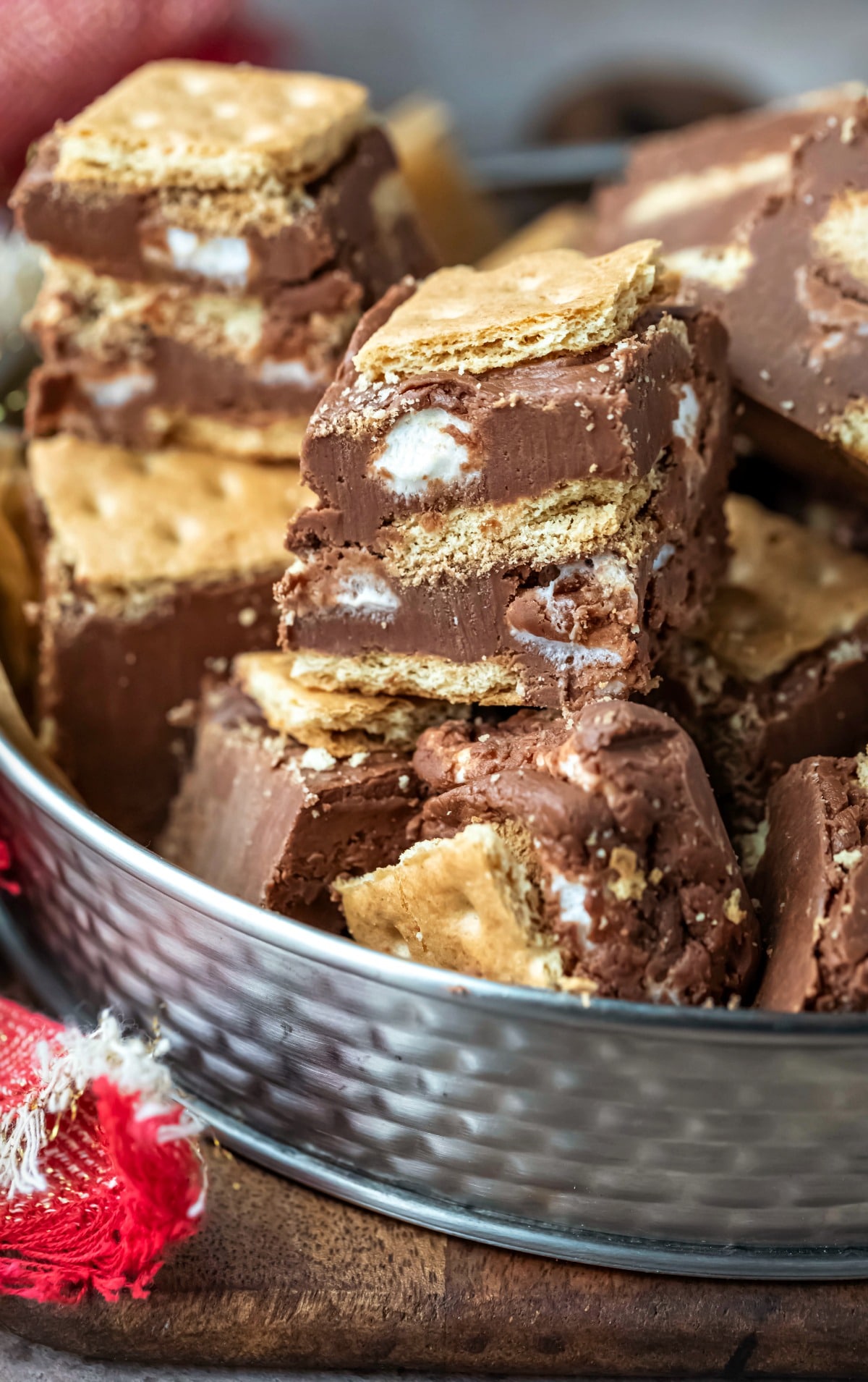 Tin of s'mores fudge on a wooden cutting board