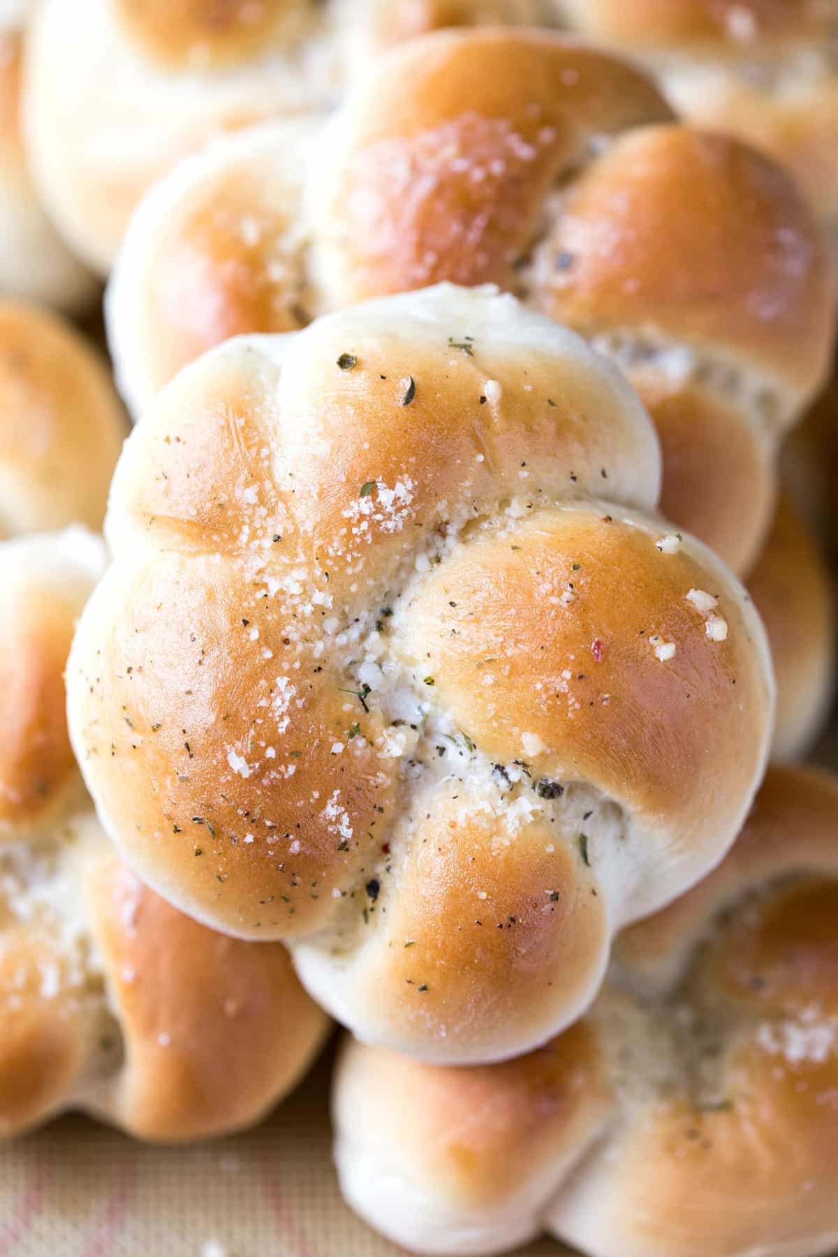 Stack of homemade Garlic Knots on a serving tray.