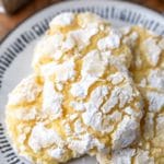 Lemon coconut cookies on a black and whit plate