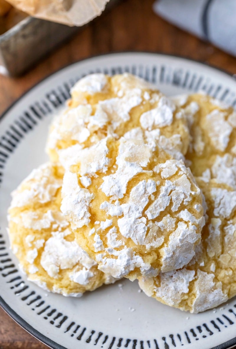 Lemon coconut cookies on a black and white plate