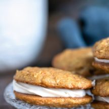 Carrot Cake Sandwich Cookies on a glass plate