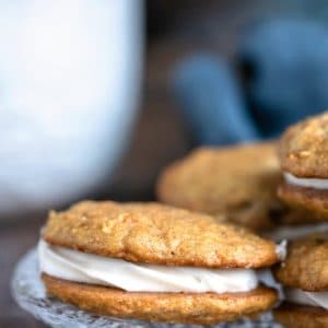 Carrot Cake Sandwich Cookies on a glass plate