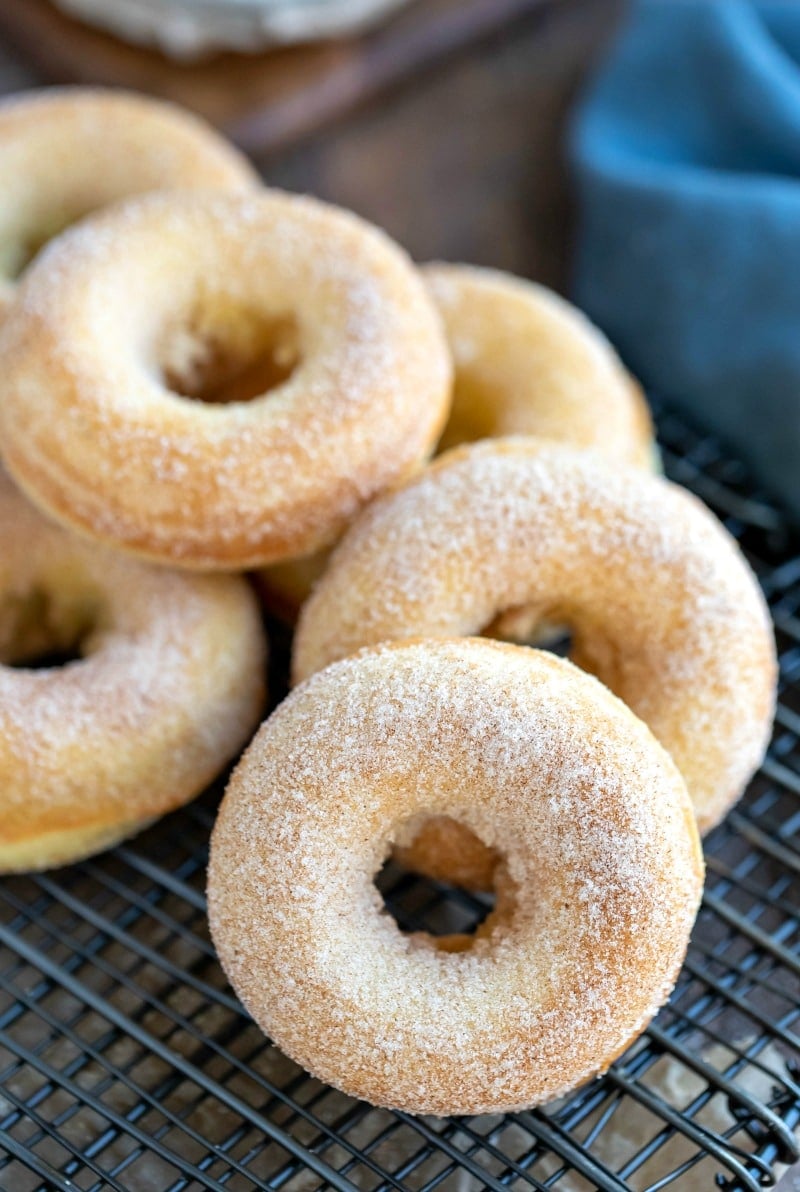 Cinnamon Sugar Baked Donuts on a black wire rack