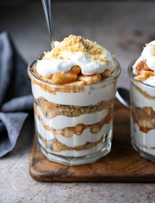 No bake apple pie parfaits next to a gray linen napkin