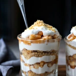 Two no bake apple pie parfaits in a glass jar