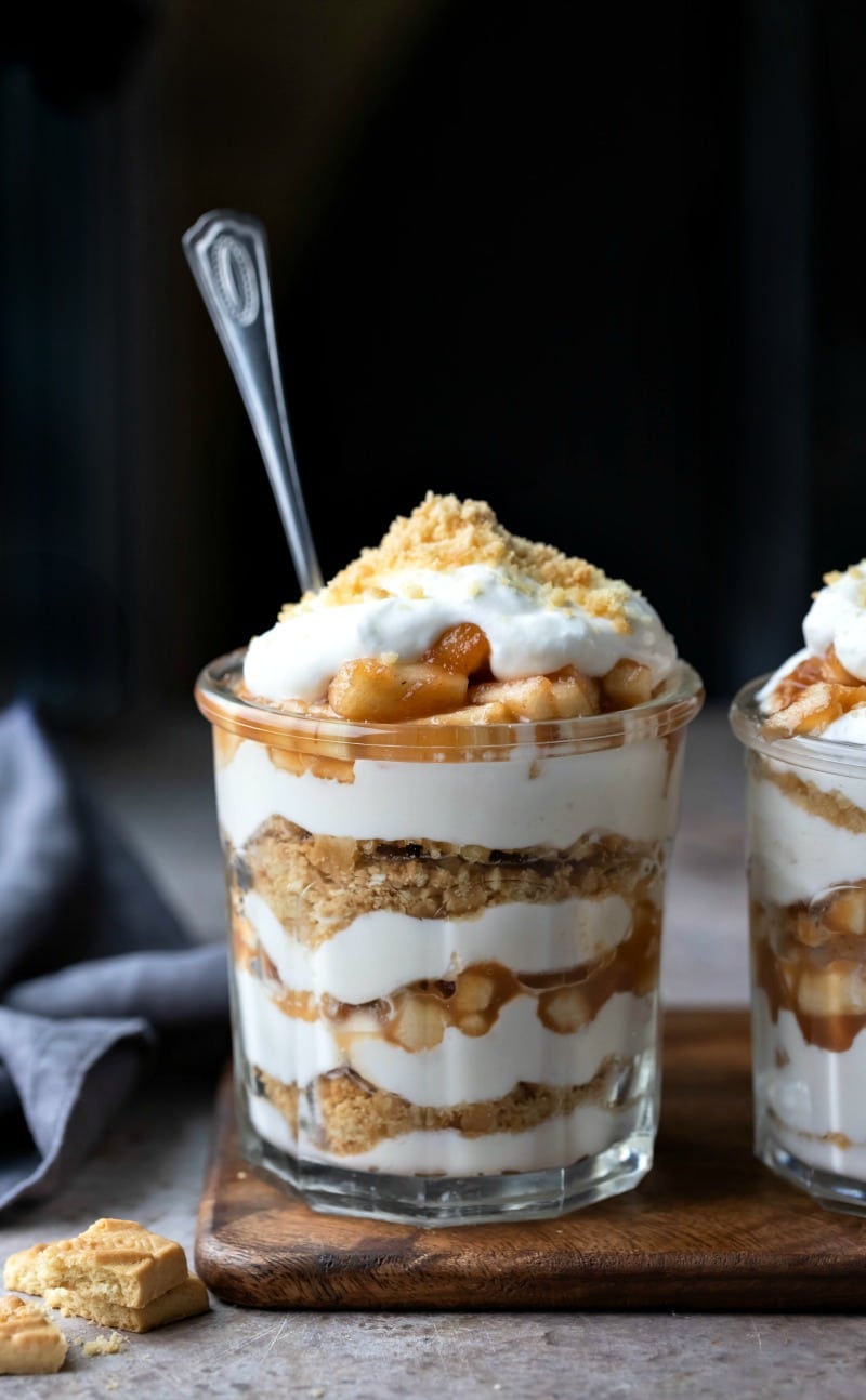 Two no bake apple pie parfaits in a glass jar