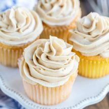 Whipped brown sugar buttercream frosting on a vanilla cupcake